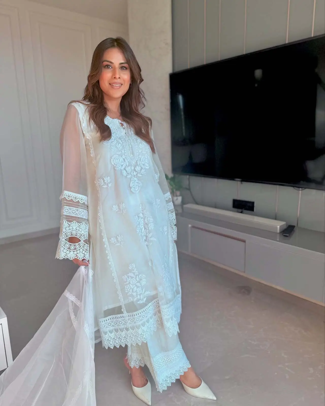 <p>Hina Khan looks ethereal in a white chikankari and net suit, exuding understated elegance. The intricate embroidery paired with the sheer net detailing adds a soft, festive charm, making it perfect for Eid prayers or daytime celebrations.</p> <p>Hina Khan looks ethereal in a white chikankari and net suit, exuding understated elegance. The intricate embroidery paired with the sheer net detailing adds a soft, festive charm, making it perfect for Eid prayers or daytime celebrations.</p>