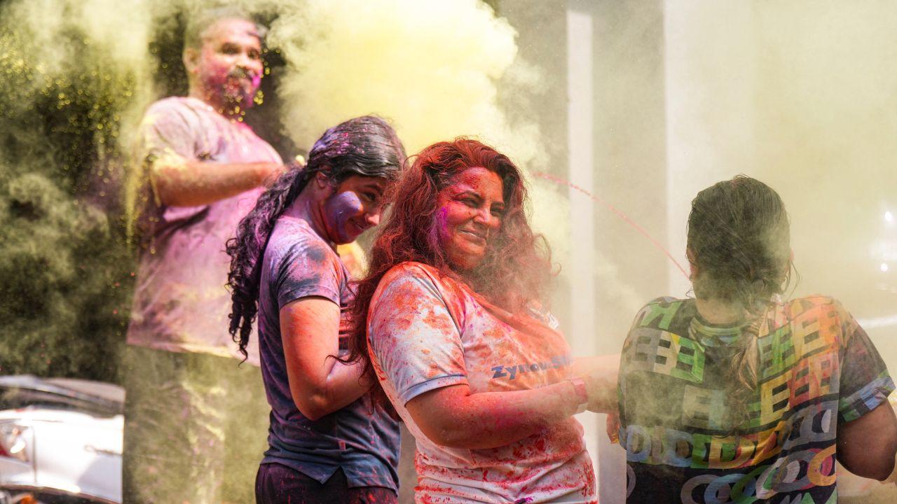 Smiles painted in pinks and yellows capture the true spirit of the festival of colours 