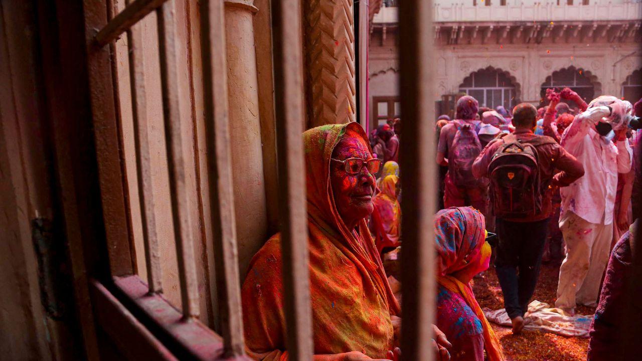Streets of Vrindavan burst into life as people dance to devotional beats, throwing vibrant colours into the air