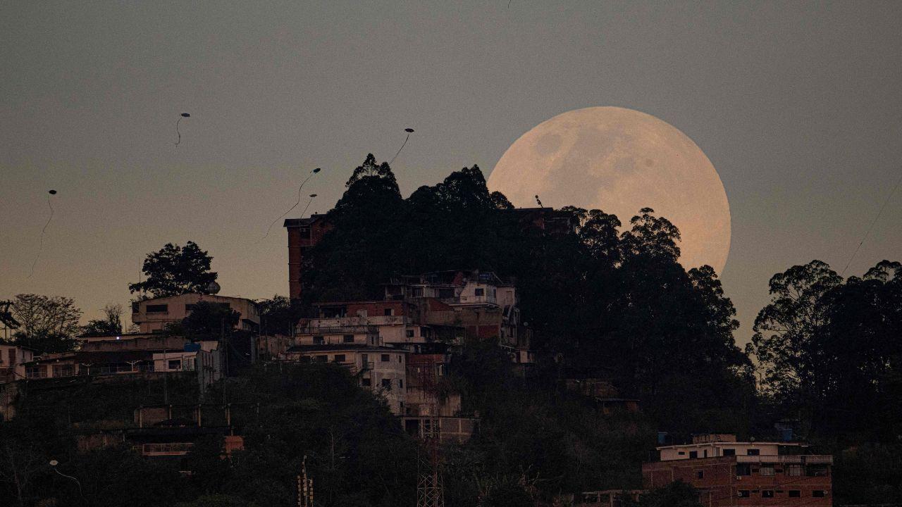 A delicate crescent moon graces the early evening sky over Venezuela’s capital on March 2