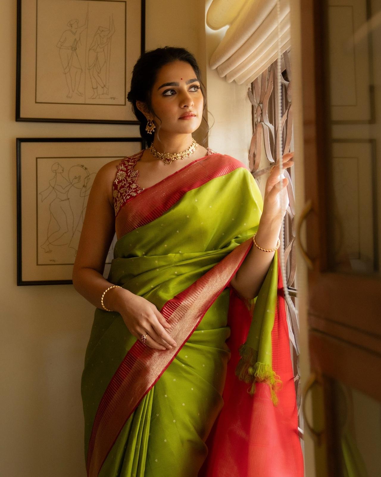 Rukmini Vasanth embraced festive elegance in a vibrant green silk saree with a rich red border, she pairs it with a heavily embroidered blouse.
