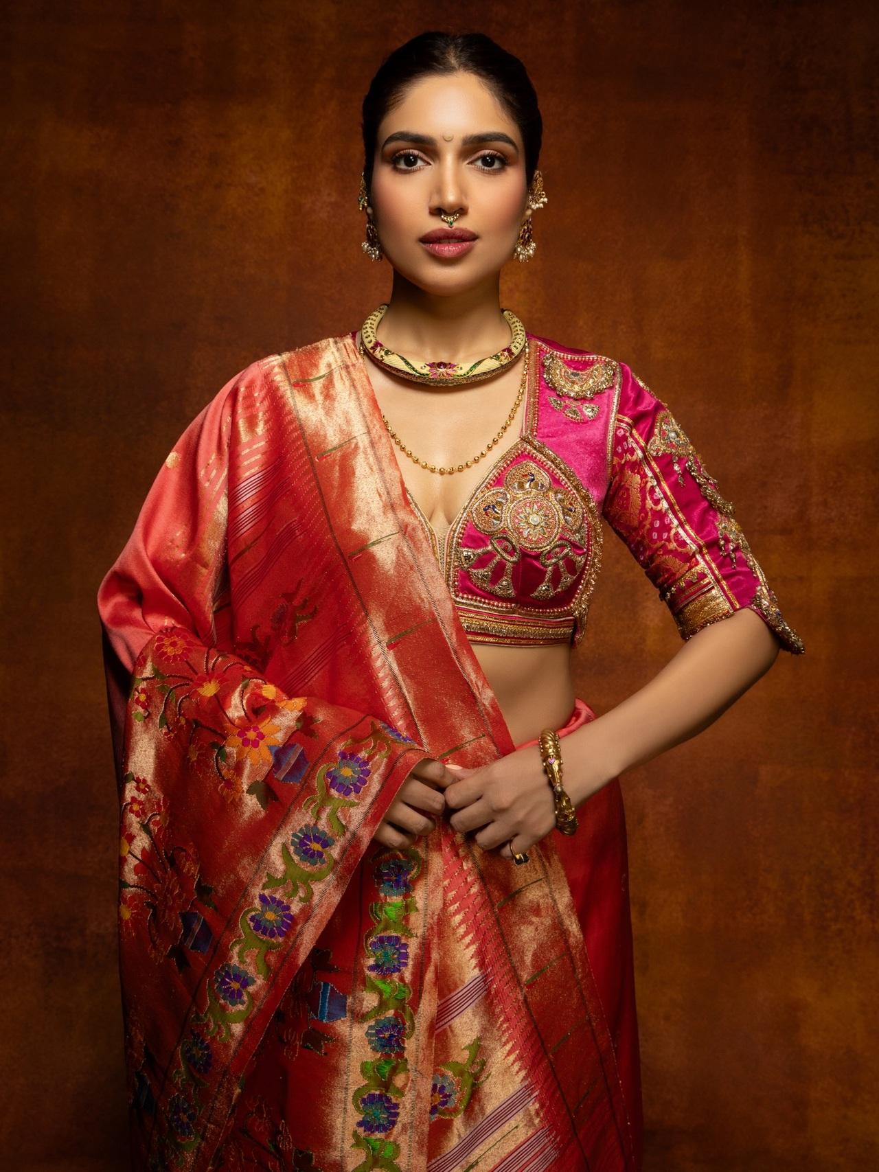 Bhumi Pednekkar embraced Marathi culture in orange silk saree featuring real gold zari work and intricate, colourful floral embroidery on the pallu and borders. She styled it with heritage jewels.