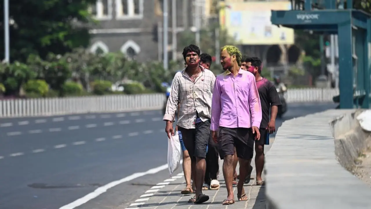 Walking through the streets with faces painted in Holi colours and smiles