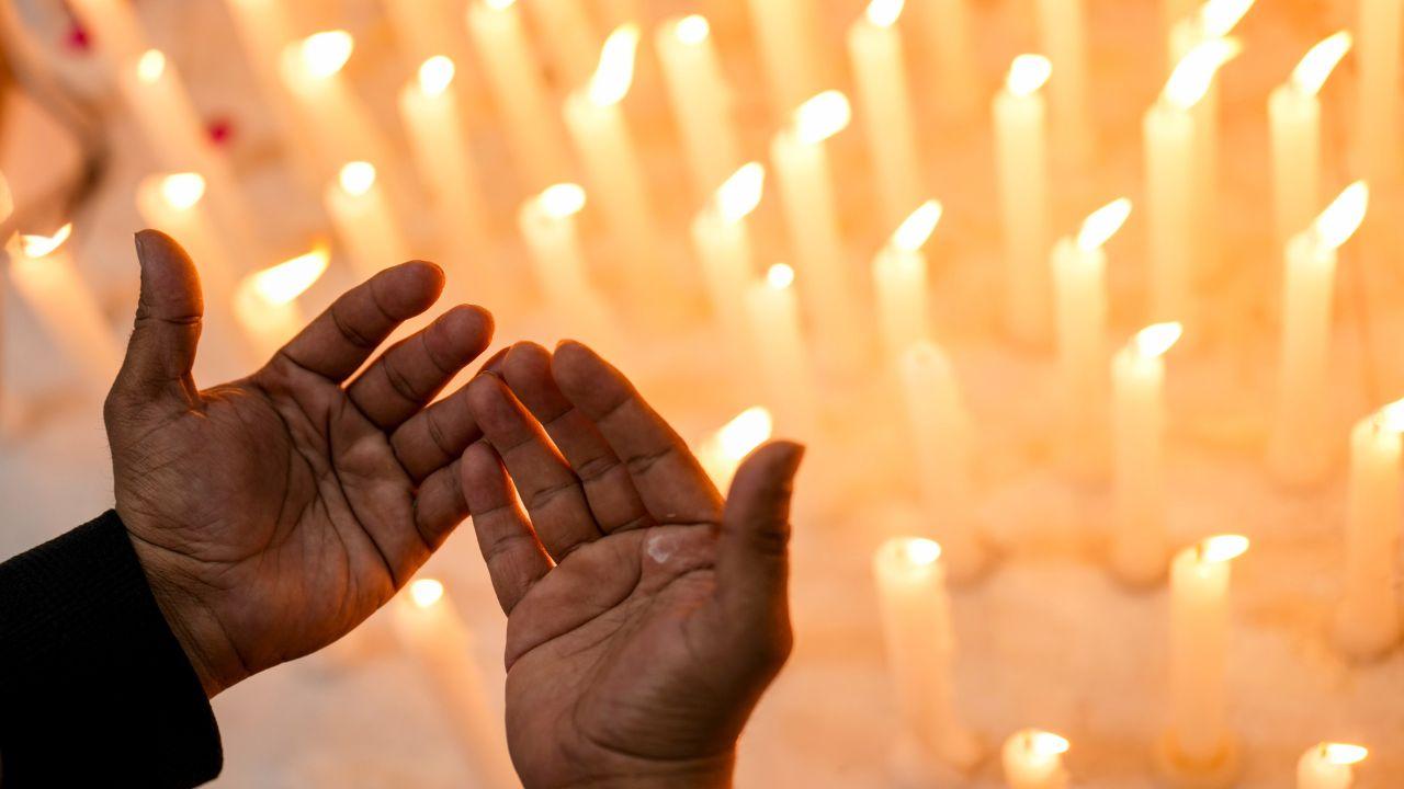 A person offers prayers for Iran's Supreme Leader Ayatollah Ali Khamenei during condolence meeting
