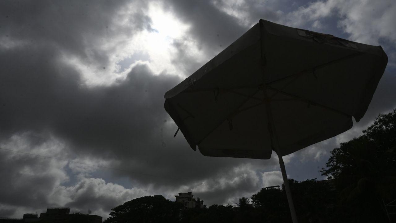 Dark monsoon clouds loom over Mumbai, painting the sky with dramatic intensity