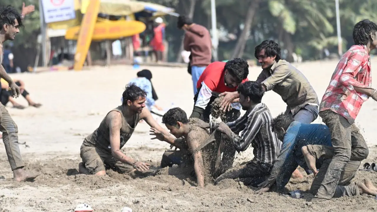 Under a warm Mumbai sun, festive crowds at Chowpatty played with water and colour, making the most of Holi by the seaside