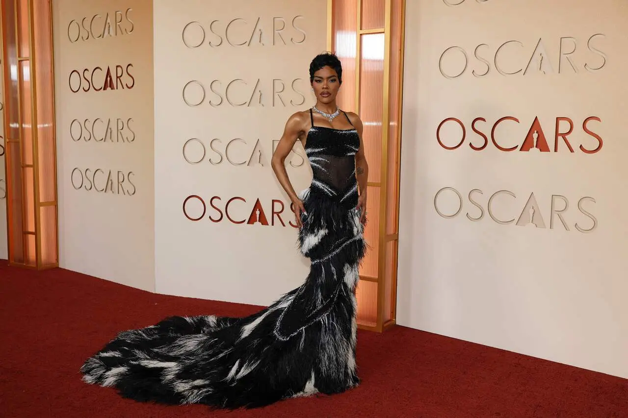 Teyana Taylor turned heads in a semi-sheer black Chanel ensemble paired with dazzling Tiffany & Co. jewellery worth over 50 carats. She accessorised with a stunning platinum and natural diamond necklace of over 18 carats. Taylor completed the look with elegant oval-shaped diamond drop earrings.