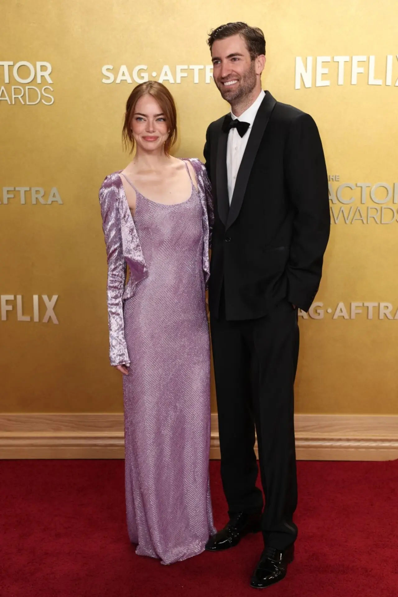 Emma Stone arrived with Dave McCary on the red carpet. While Emma looked gorgeous in a purple sparkly slip on dress, paired with abeaded jacket, Dave kept it classy in a tuxedo.
