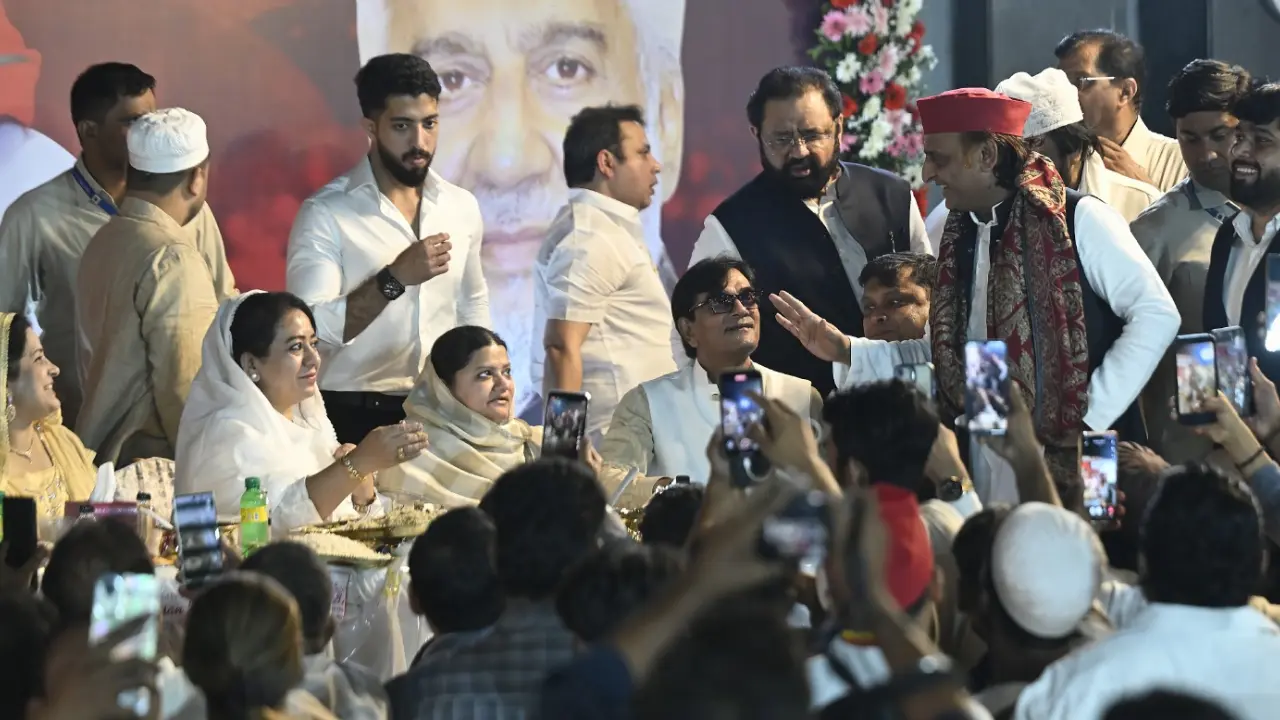 Yadav greets members of the party at the event. 