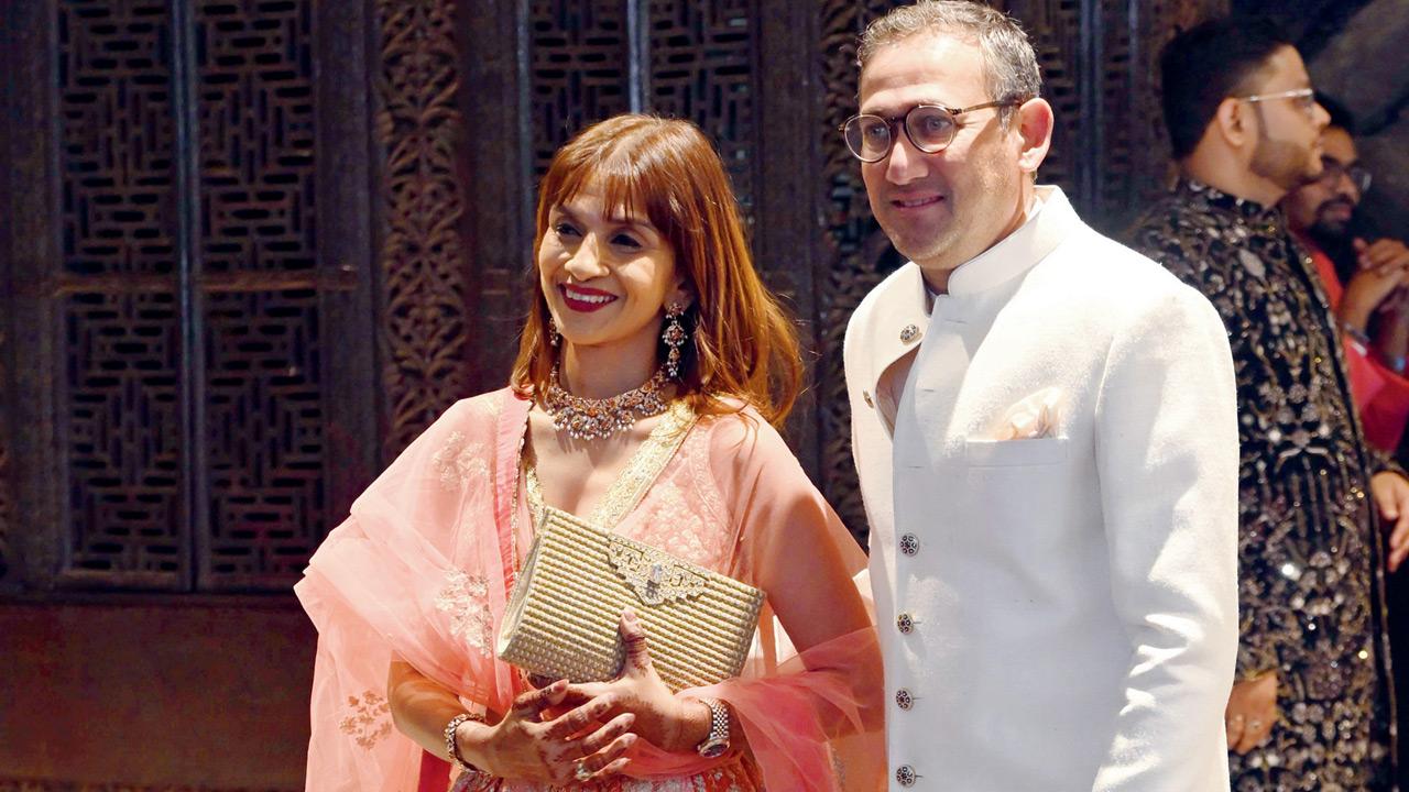 Former Indian cricketer and national selector Ajit Agarkar arrives with wife Fatima Ghadially at the wedding celebrations of Arjun Tendulkar in Mumbai on Wednesday