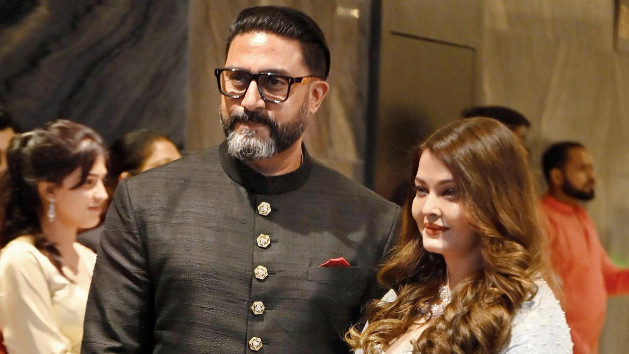 Bollywood couple Abhishek Bachchan and Aishwarya Rai Bachchan arrive to bless the newlyweds at the wedding of Arjun Tendulkar