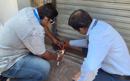 BMC officials seal a property in Mumbai. PIC/BMC