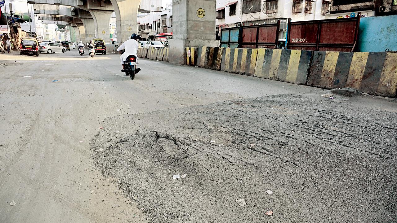 The road damaged by a passing vehicle, on Monday