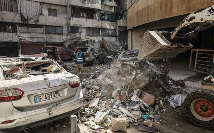 Workers clear debris from a street after an Israeli airstrike in central Beirut's Zuqaq al-Blat neighbourhood on Wednesday. PIC/AFP