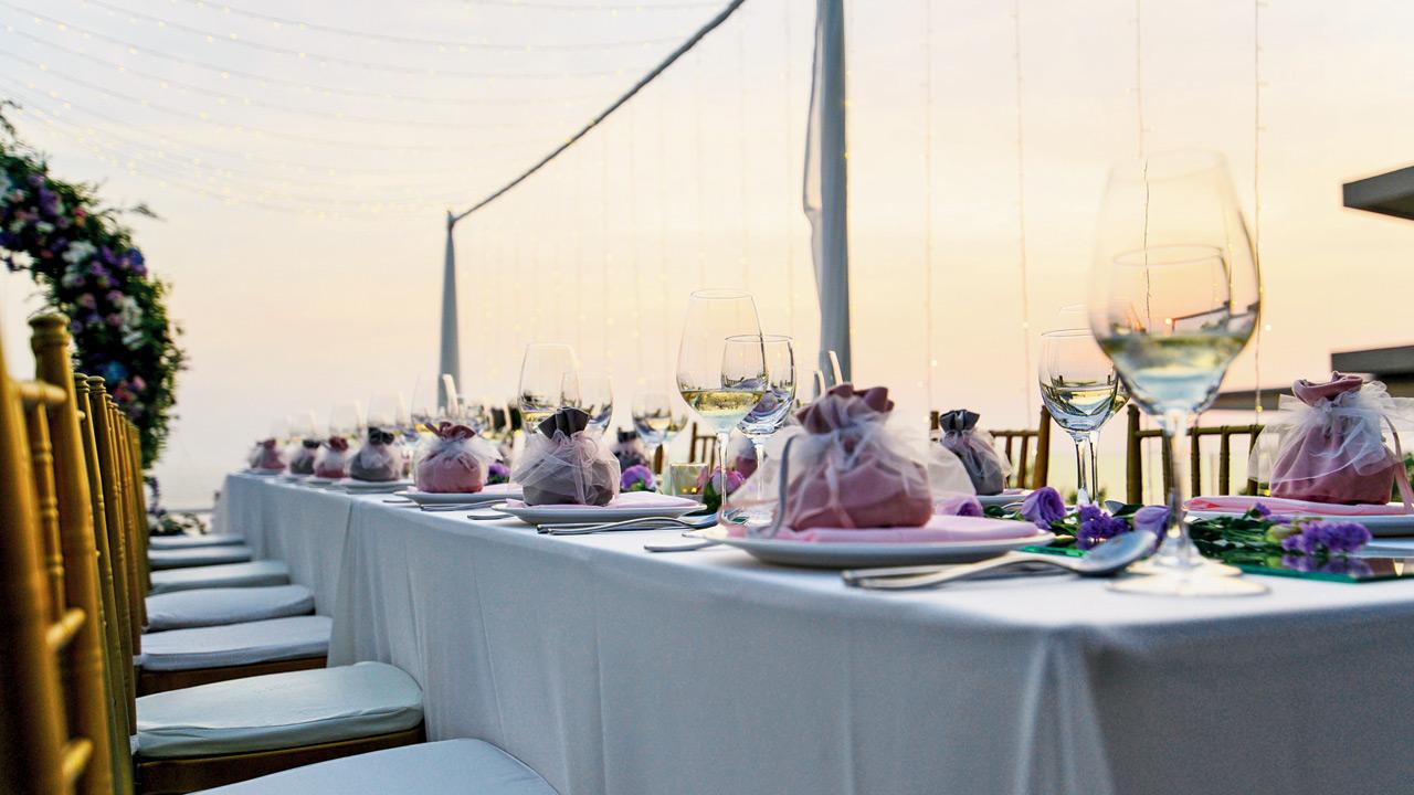 A lightly styled dining table in soft pastel tones for a terrace celebration. Representation pic/stock 