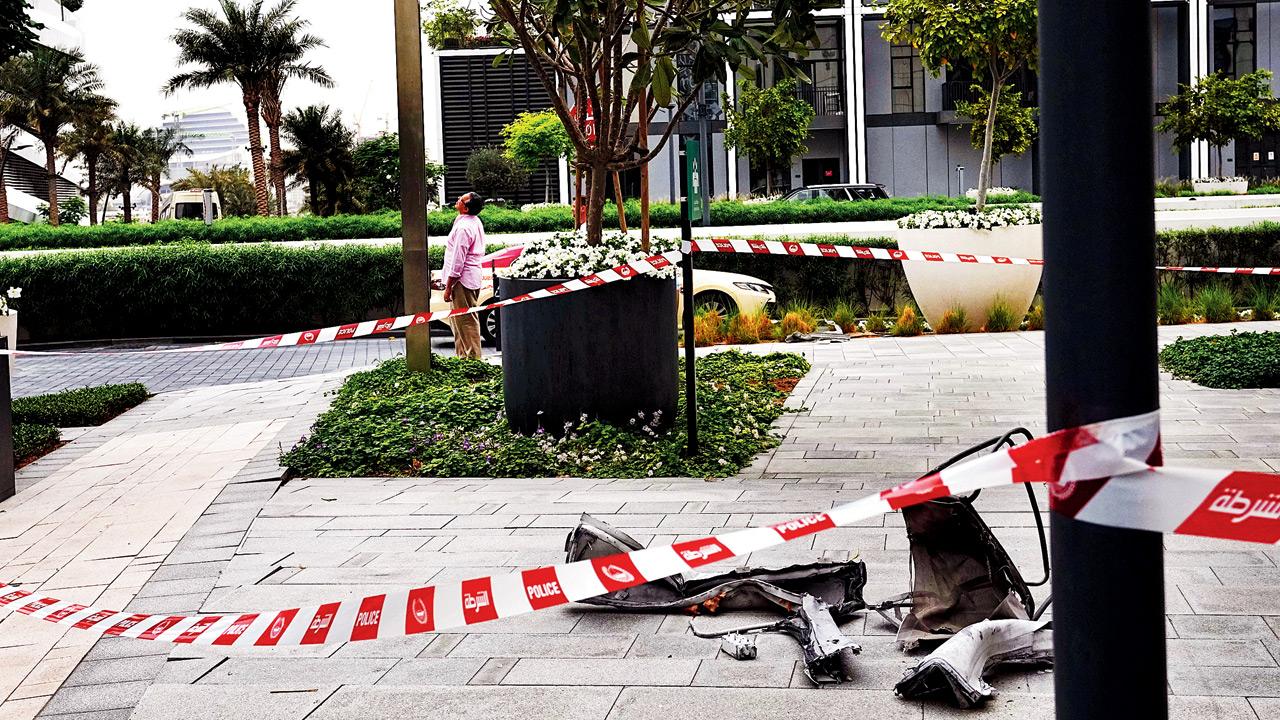 Debris lies on sidewalk at Address Creek Harbour hotel in Dubai after a drone strike