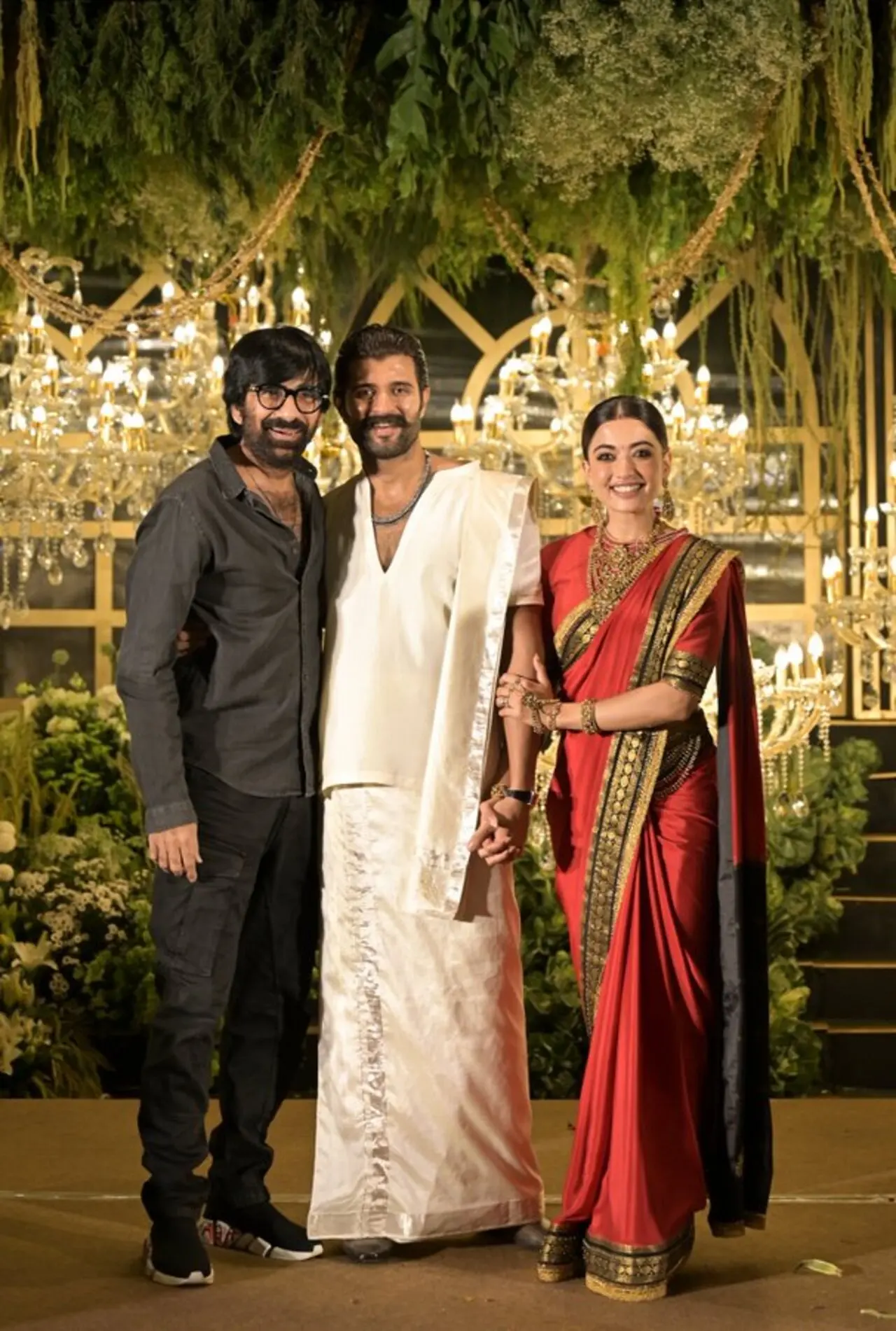 Vijay and Rashmika posed happily with Ravi Teja at the reception, sharing a cheerful moment for the cameras. 