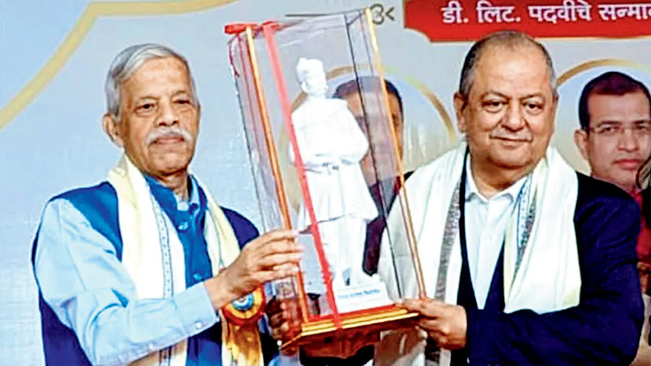 TVM Chancellor Dr S Srikumar presents an award to (right) Hemant Oberoi