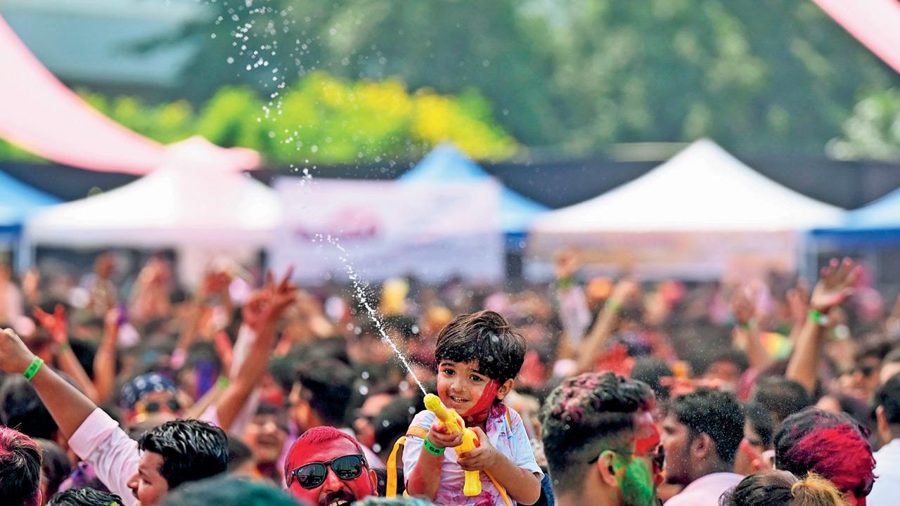 A youngster sprays water through a pichkari at Inorbit Mall, Malad West. PIC/SATEJ SHINDE