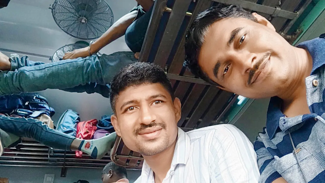 (From left to right) PSI Kiran Bhosle and API Dattaray Khade travel by train from Mumbai to West Bengal. PICS/BY SPECIAL ARRANGEMENT