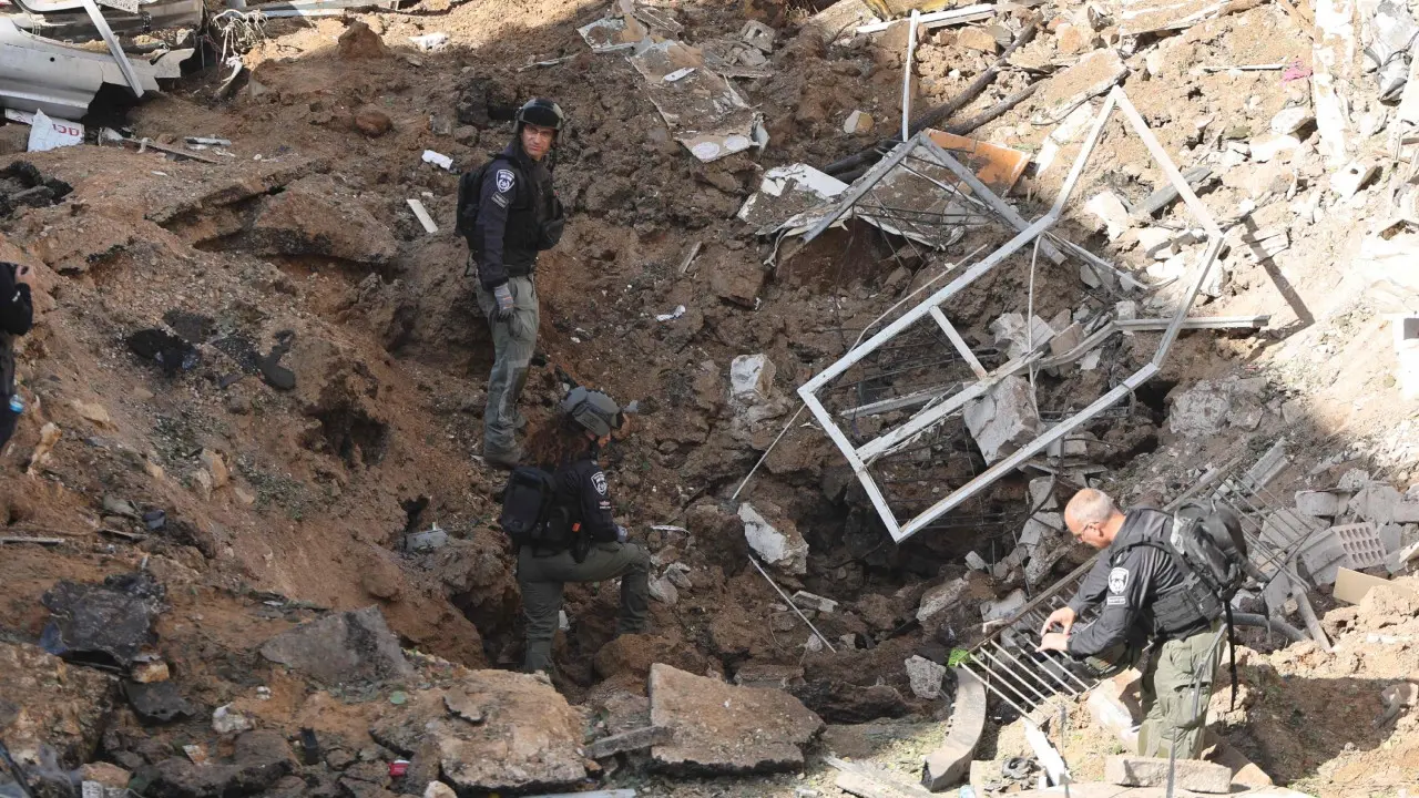 Iran targets Israel, Gulf Arab states as Trump says US in talks to end war