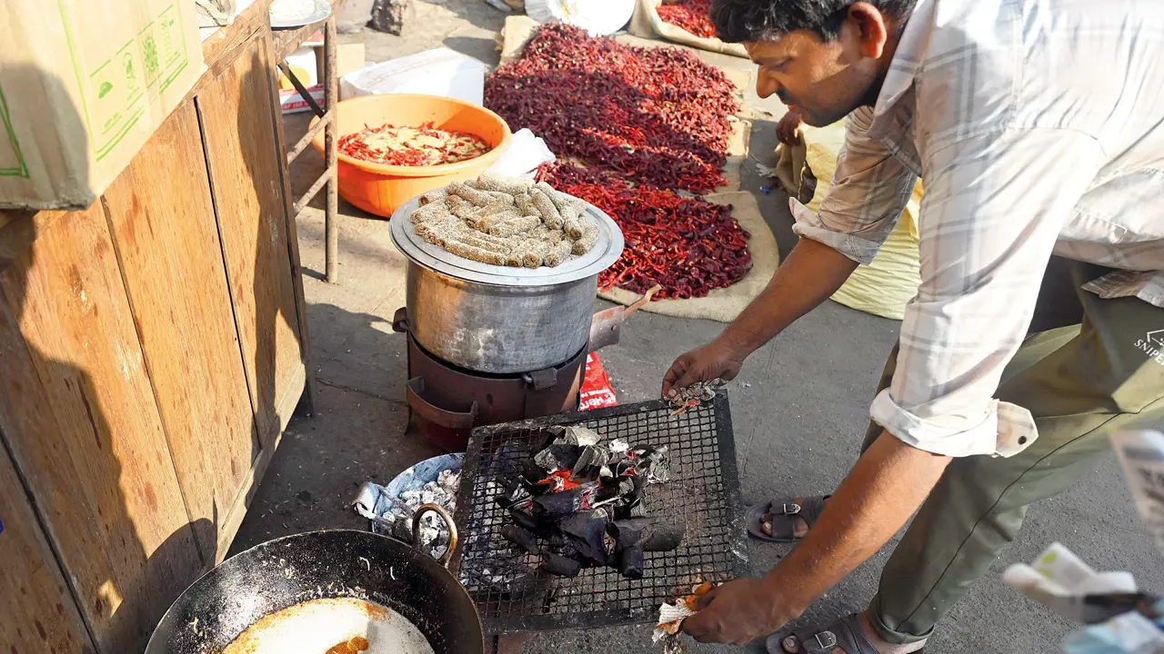 A small food stall at Lalbaug has switched to a coal sigdi