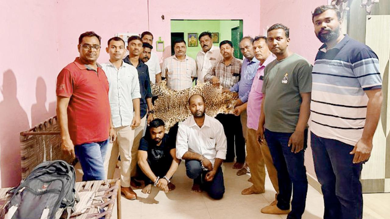 Accused Vishal Varthe (in white, kneeling) and Mayur Mhatre (in black, kneeling) in custody of the forest officials. PICS/BY SPECIAL ARRANGEMENT