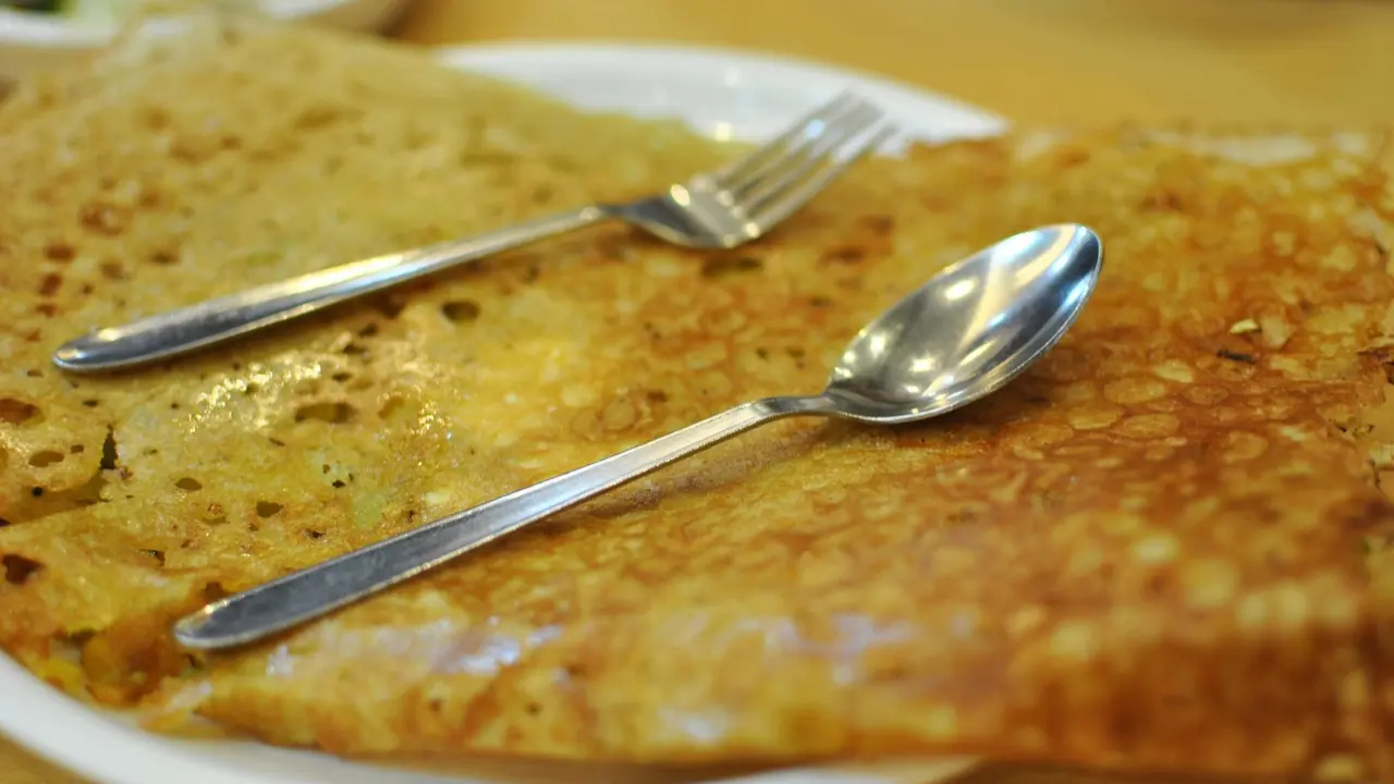 Neer dosaChef Ajit Tiwari, executive chef, Holiday Inn Bengaluru Racecourse, believes the Neer Dosa is a lesser-known dosa variety. It is a coastal specialty from Karnataka, stands out for its remarkable simplicity and finesse. Prepared with a thin, non-fermented batter of soaked rice, water, and salt, it is gently swirled across the pan to create a soft, lace-like crepe. Light, delicate, and subtly flavoured, Neer Dosa pairs beautifully with coconut chutney, vegetable stews or coastal seafood preparations. It demonstrates how minimal ingredients, when handled with precision, can create something truly exceptional. (Image for representational purpose only)