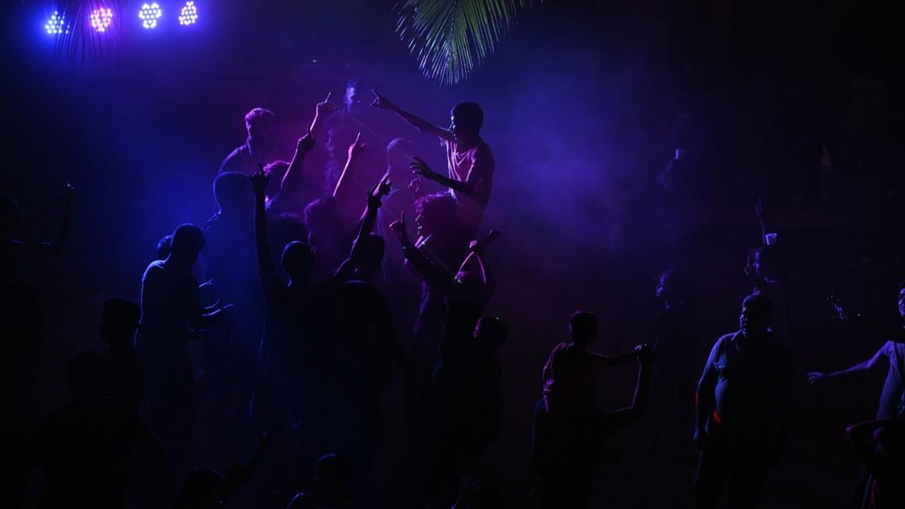 A beautifully decorated Holika Dahan bonfire burns bright between chawls and open spaces during traditional Shimga celebrations in Mahim Koliwada.