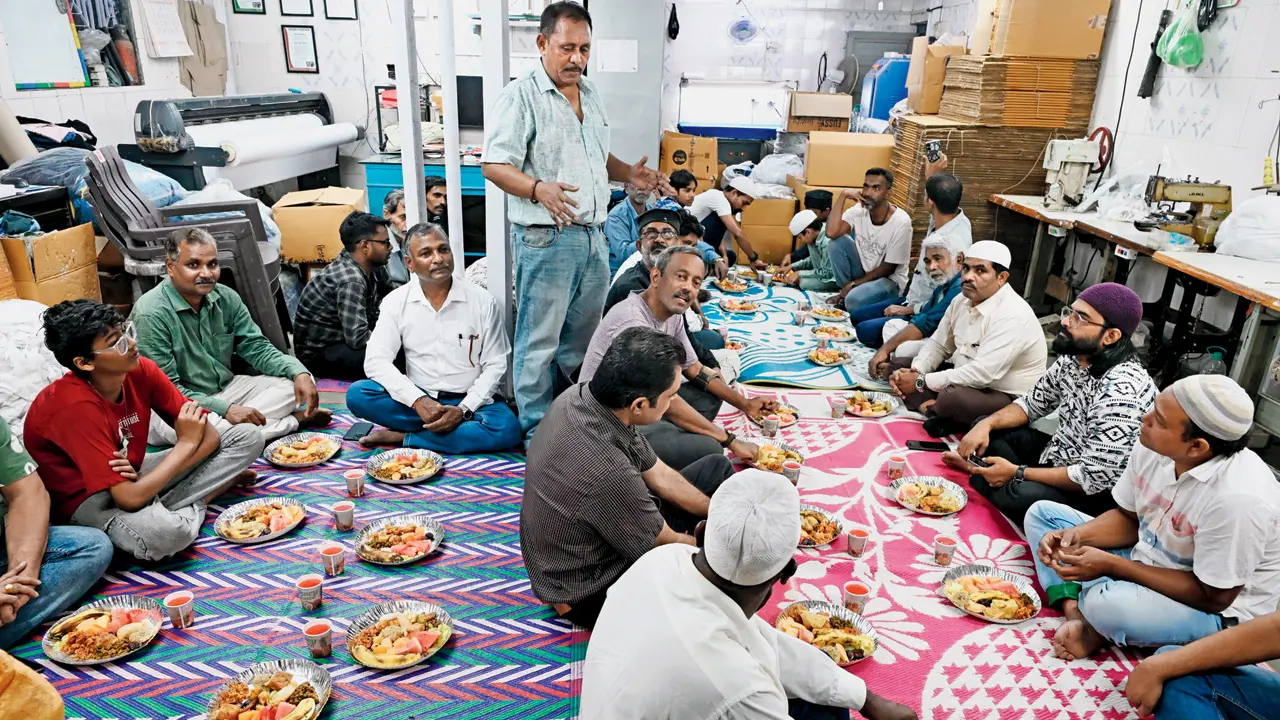 Malwani residents break their fast at the iftaar organised by the Safal Vikas Welfare Trust on Saturday