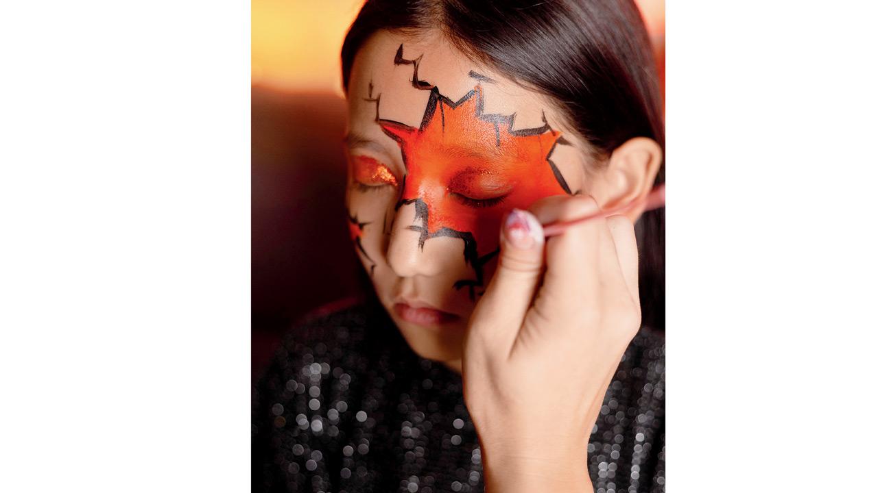 Face painters and temporary tattoo artists