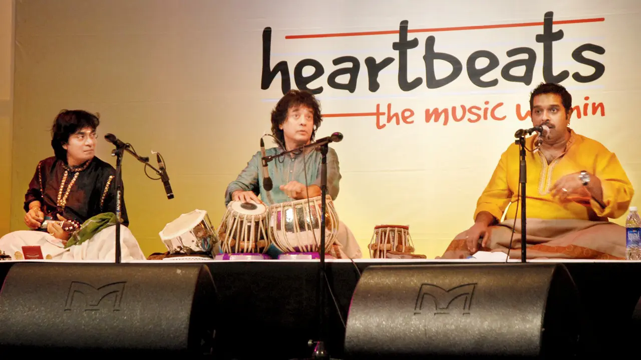 (From left) U Srinivas, Ustad Zakir Hussain and Shankar Mahadevan during a performance. Pics Courtesy/Grace Foundation; artistes
