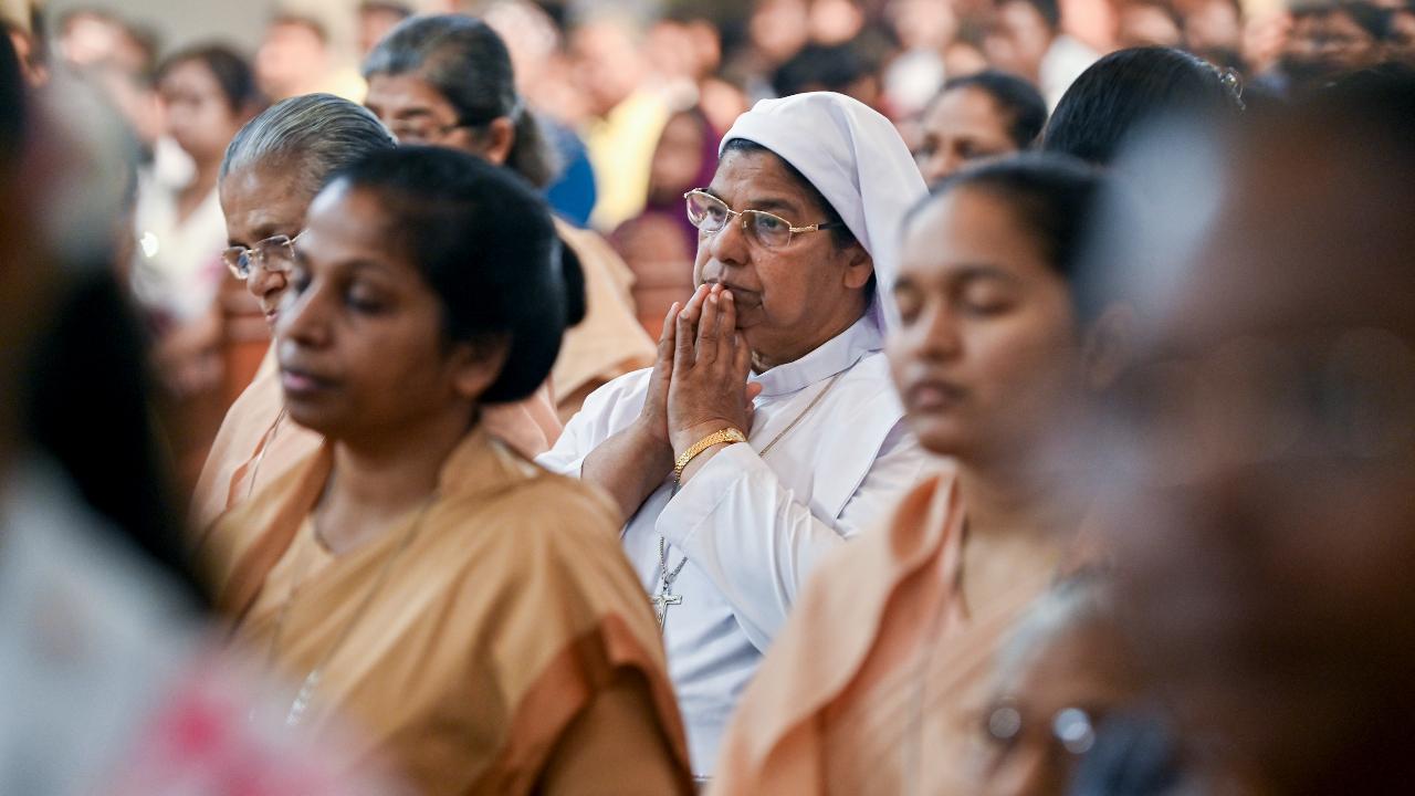 Christians take part in a mass prayer ceremony at the St Joseph's Cathedral Church on the occassion of Palm Sunday, in Prayagraj in Uttar Pradesh