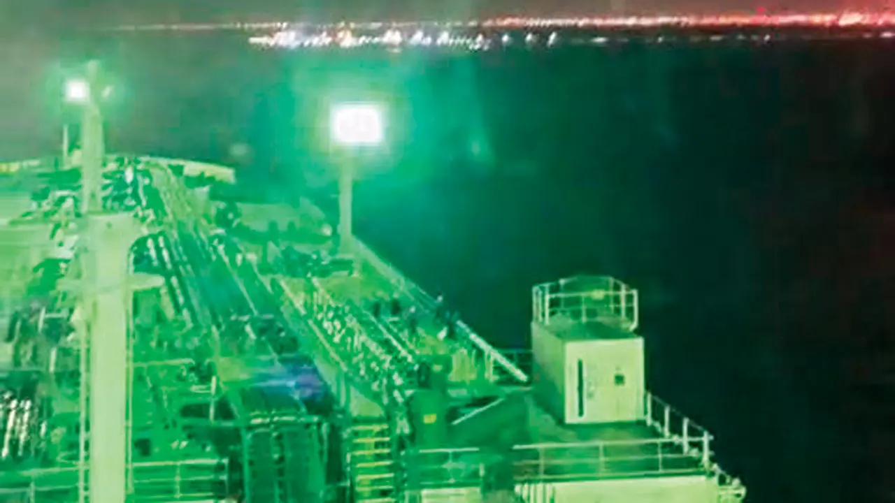 A missile flies above Captain Vishwakarma’s oil tanker, which is anchored near the Strait of Hormuz