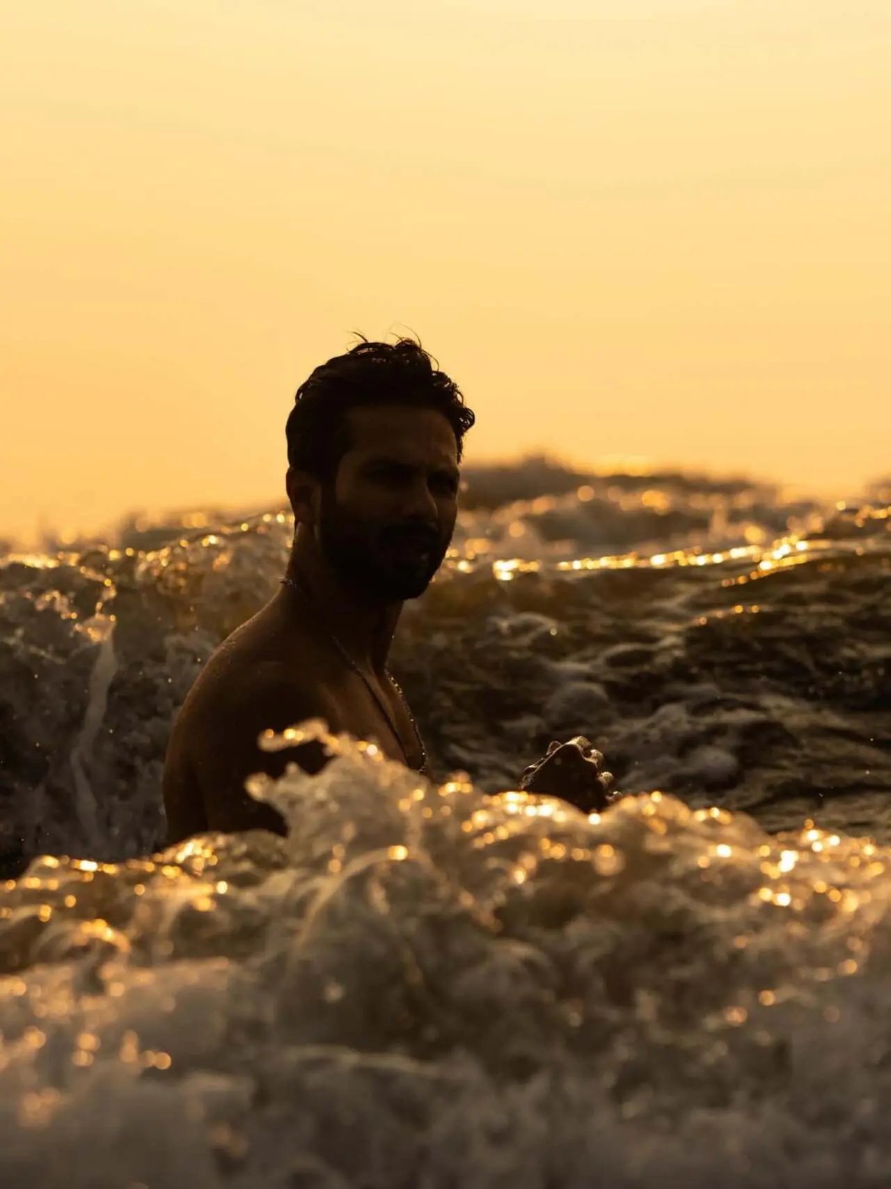 In one of the pictures, Shahid was seen taking a dip in the sea as the waves surrounded him