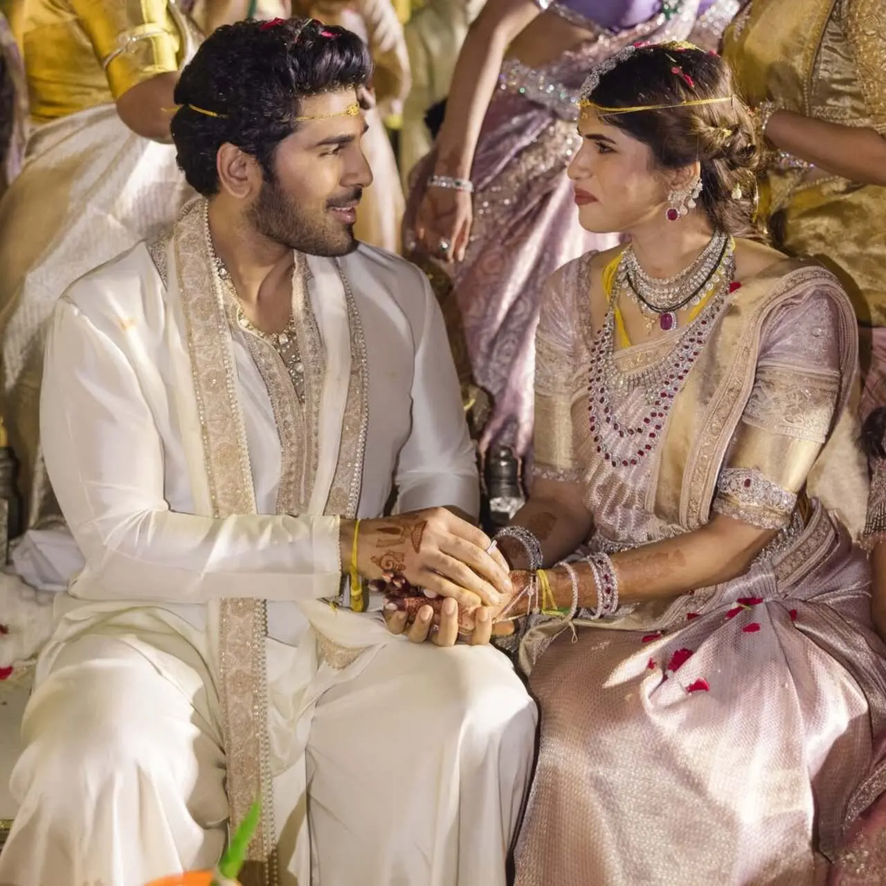 The bride and groom looked absolutely stunning in their traditional pastel ethnic ensembles. Allu Sirish is wearing a classic white traditional outfit with beautiful gold embroidery, which gives him a royal and graceful look.