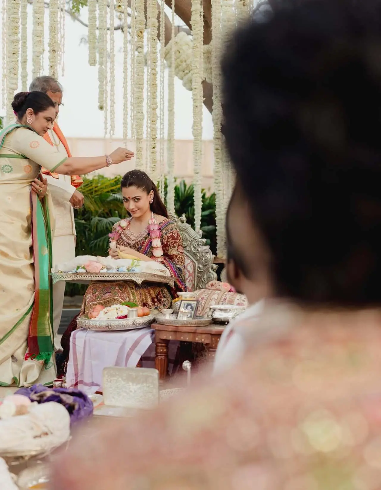 As Vijay Deverakonda’s parents performed the wedding ritual, Rashmika Mandanna was seen lovingly gazing at him, capturing a tender moment amid the ceremony.