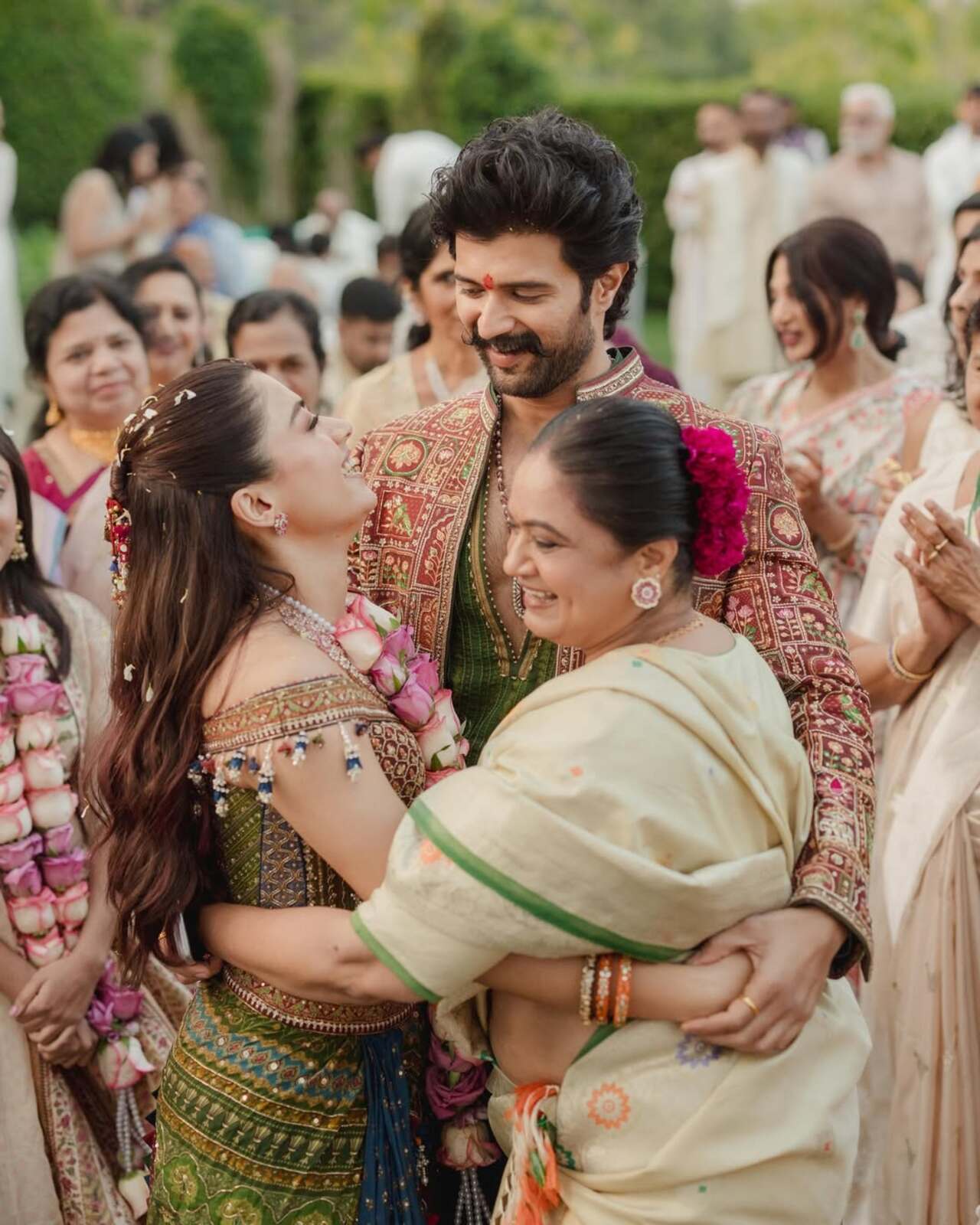 Vijay Deverakonda shared a heartfelt moment as he warmly hugged his mother and Rashmika Mandanna during the celebrations.
