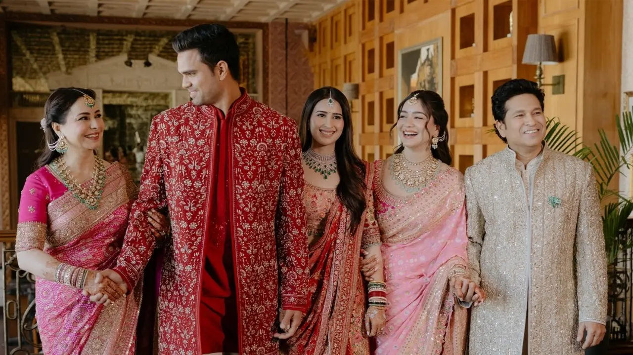 Sara Tendulkar shared a beautiful family picture featuring the newlyweds Arjun Tendulkar and Saaniya Chandhok with their parents, Sachin Tendulkar and Anjali Tendulkar. The family looked radiant as they posed together, capturing a joyful moment.