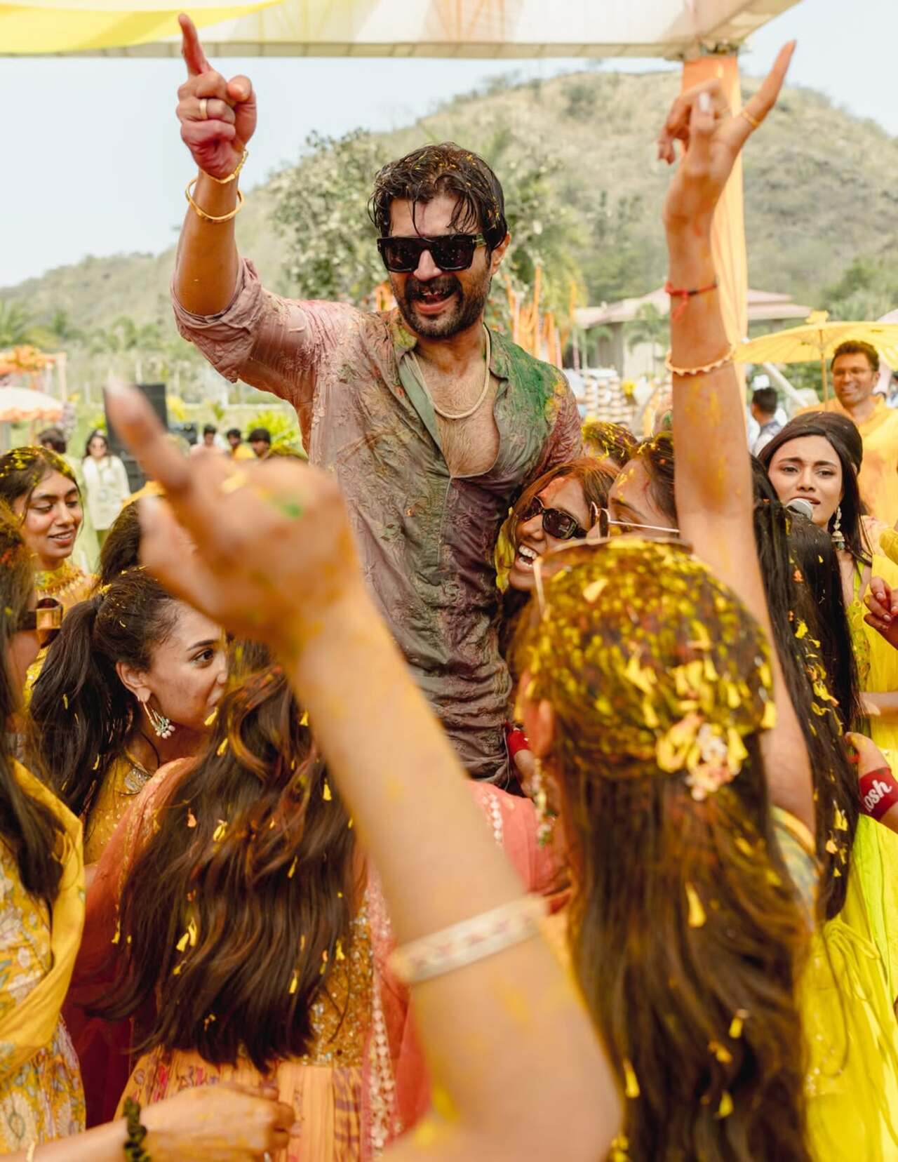 Vijay Deverakonda was seen dancing with loved ones, covered in vibrant colours during the Haldi celebrations. Surrounded by family and friends, he embraced the moments with infectious energy and a wide smile.