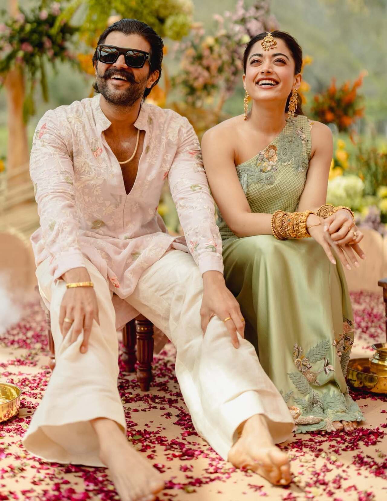 The Pushpa actress opted for a green off-shoulder dress with golden embellishments. She completed the look with big golden jhumkas, a mang tika, and complementary bangles, with her hair tied in a ponytail. On the other hand, Vijay looked all handsome in a cream kurta and white pajamas.