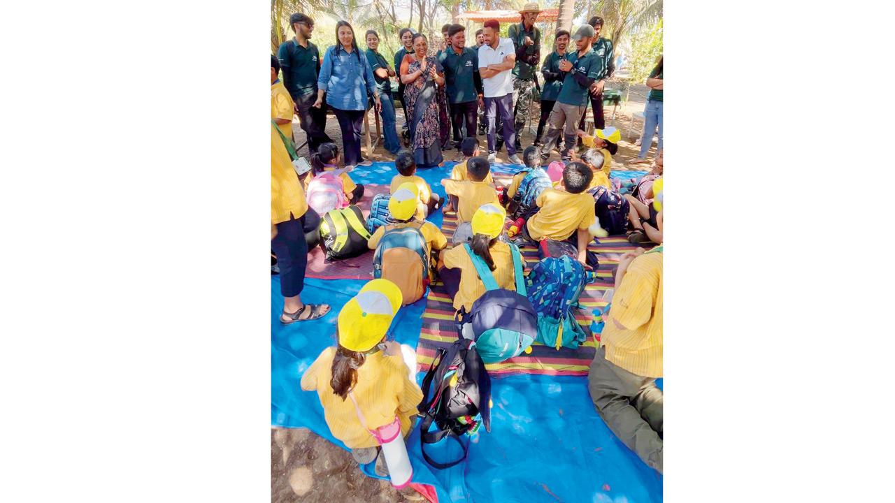 Bhavesh Pawade (centre) and his family receive thanks from students at the farm after a productive day 