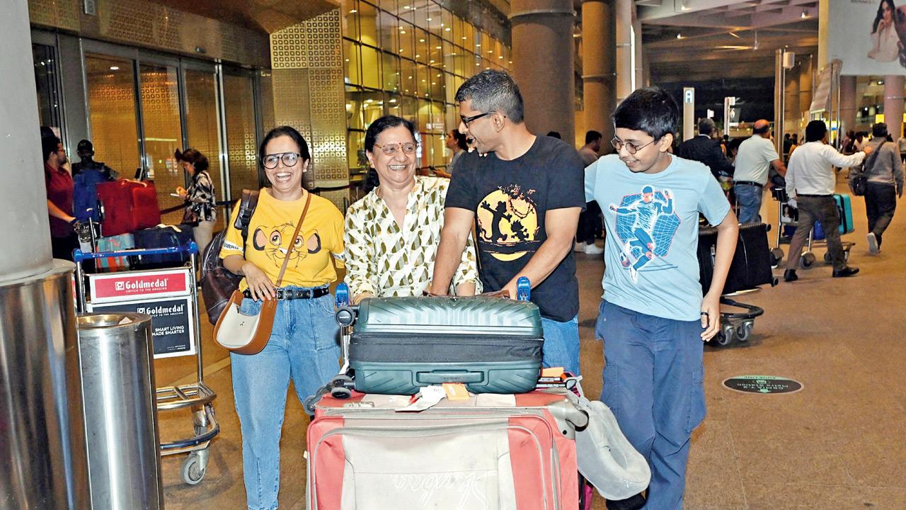 Asha Haveli (second from left) is reunited with her family at CSMI Airport on Monday