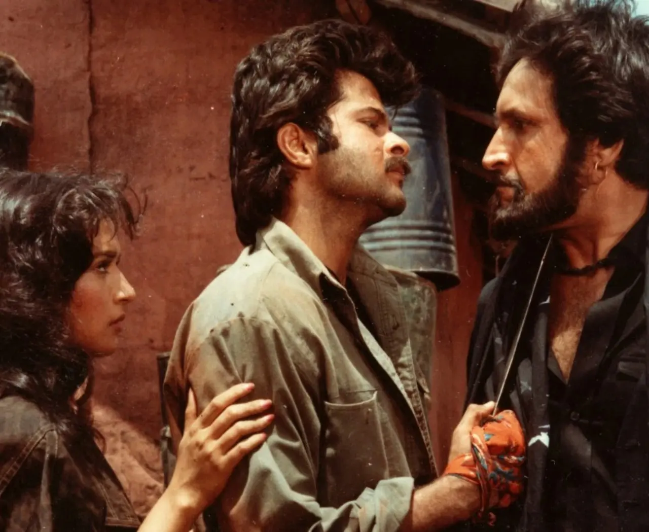 Tezaab
Tezaab is a gritty romantic drama that turned Anil Kapoor into an overnight sensation. Paired opposite Madhuri Dixit, he played the intense and rebellious Munna, while the song “Ek Do Teen” became a nationwide craze.