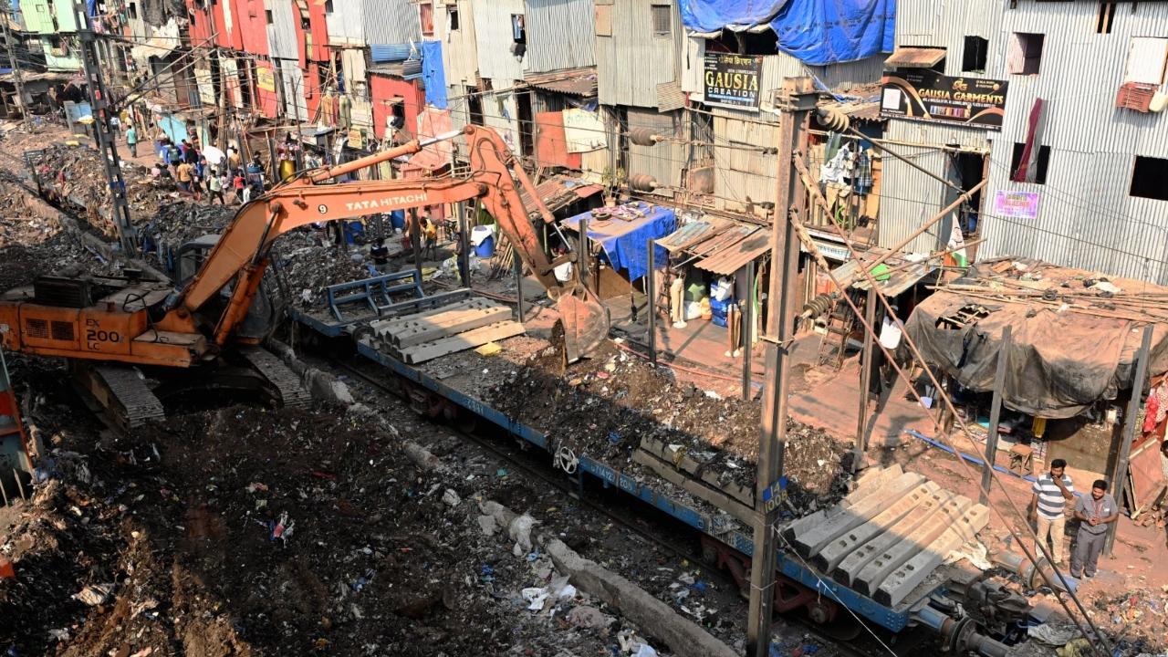 Along with installing the fencing, workers were also seen removing accumulated waste and debris from near the tracks to ensure a cleaner environment and reduce safety risks