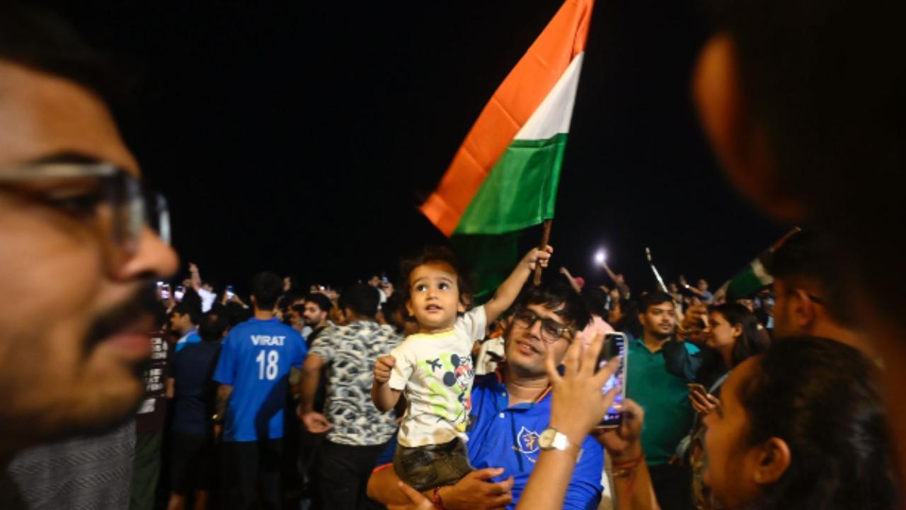 Indian fans wave the tricolour as they celebrate the team's victory at Marine Lines (Pic: Ashish Raje)