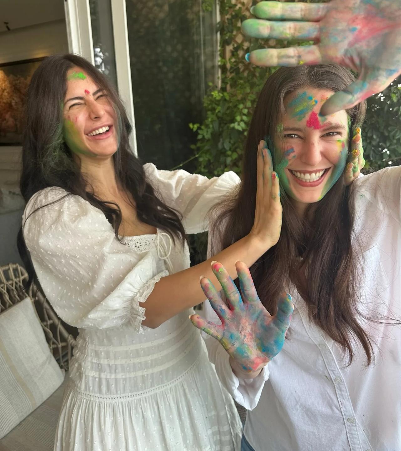 Katrina Kaif keeps her Holi look effortlessly fresh in a breezy white one-piece dress. Minimal yet festive, the airy fabric and relaxed fit strike the right balance between comfort and style.