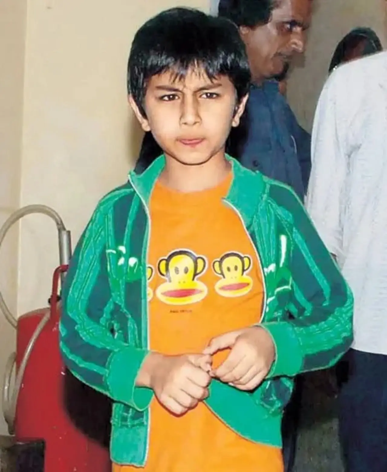 Ibrahim dons a green jacket for a sporty and cool look in this sweet picture.
