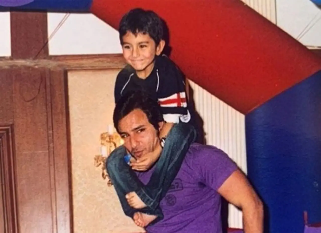 This picture captures a sweet father-son moment as Saif carries his son on his shoulder, while Ibrahim enjoys the ride.