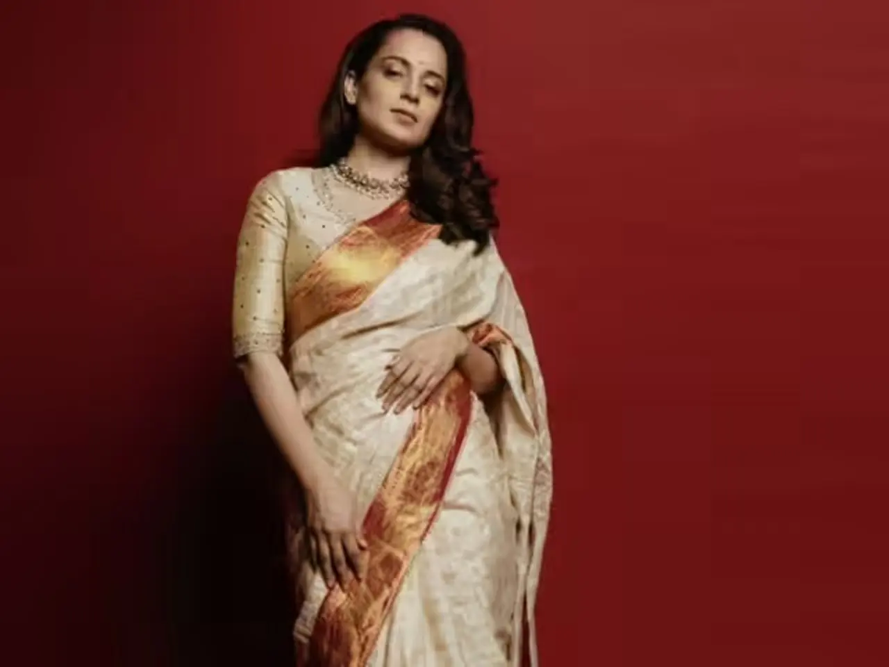 This beige and red Tussar silk saree is pure vintage and classic.
